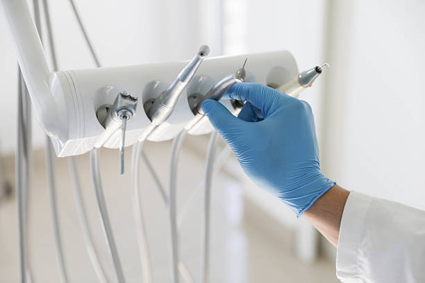 Professional Tooth Extraction technician working in Lowndes County County, MS
